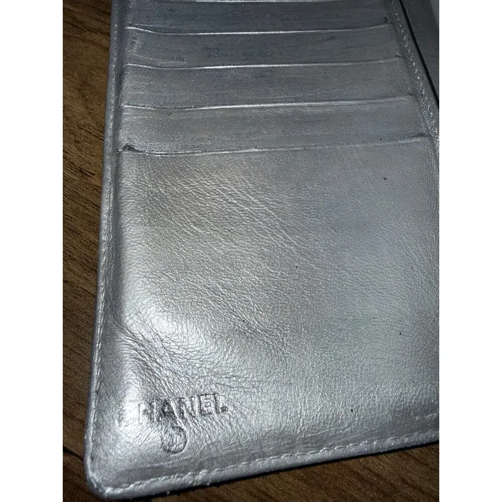 Chanel Icon Symbols Bifold Wallet Black Embossed Metallic Silver Kiss Lock